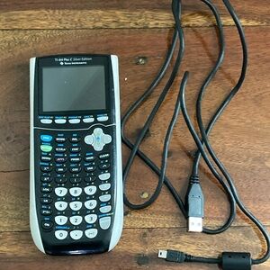 Texas Instruments Graphing Calculator Black and Silver Design with USB Chord